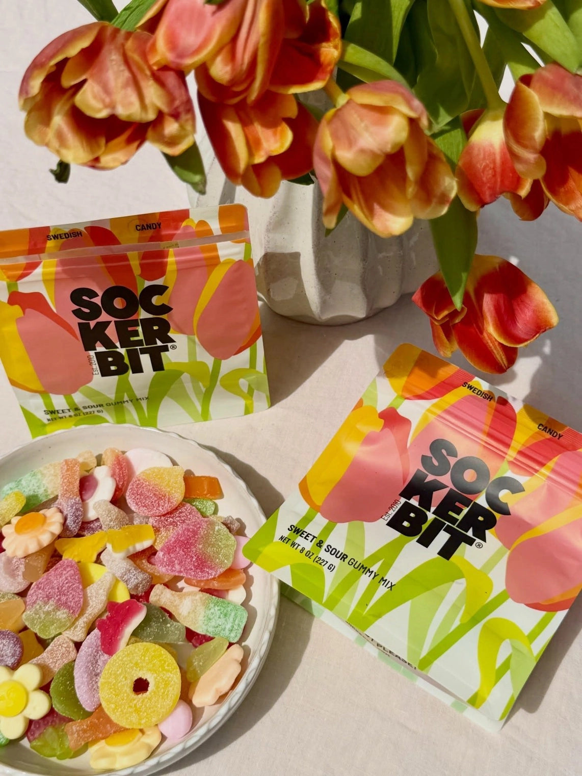 tray of candy and bags of candy and tullips