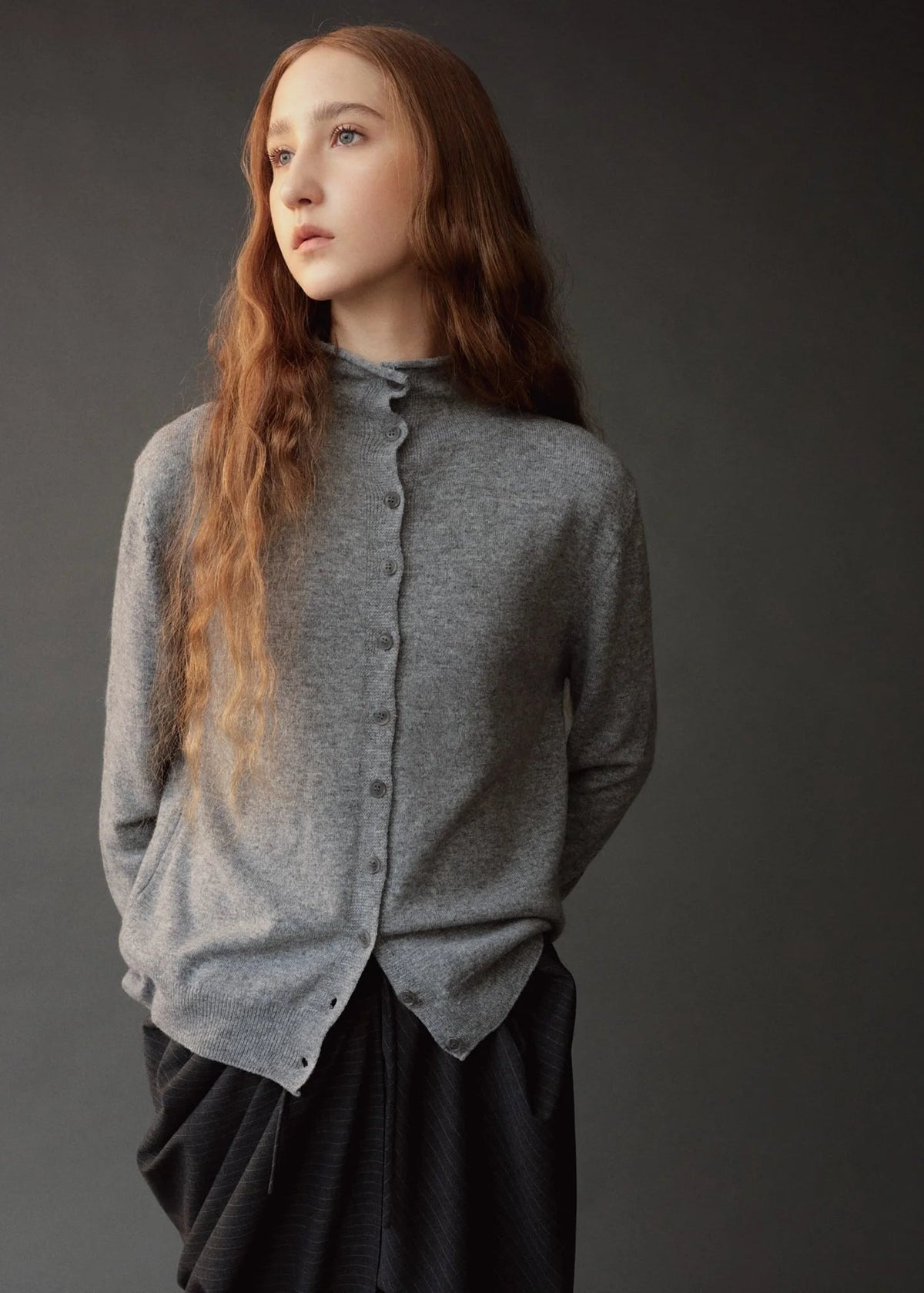 gray button down cardigan with mock neck on model 