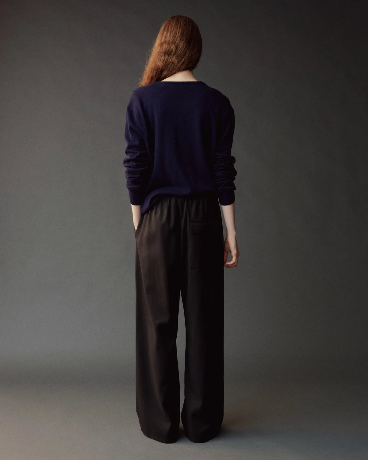 wool drawstring pants on model from back