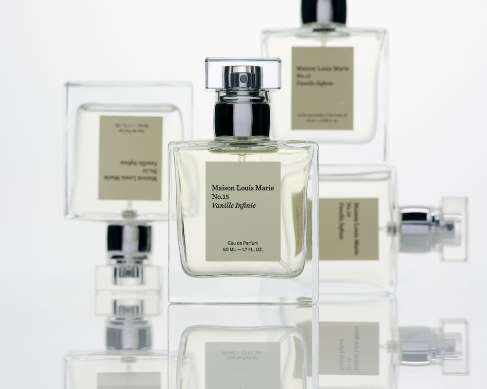 Collection of Maison Louis Marie perfume bottles on a white background