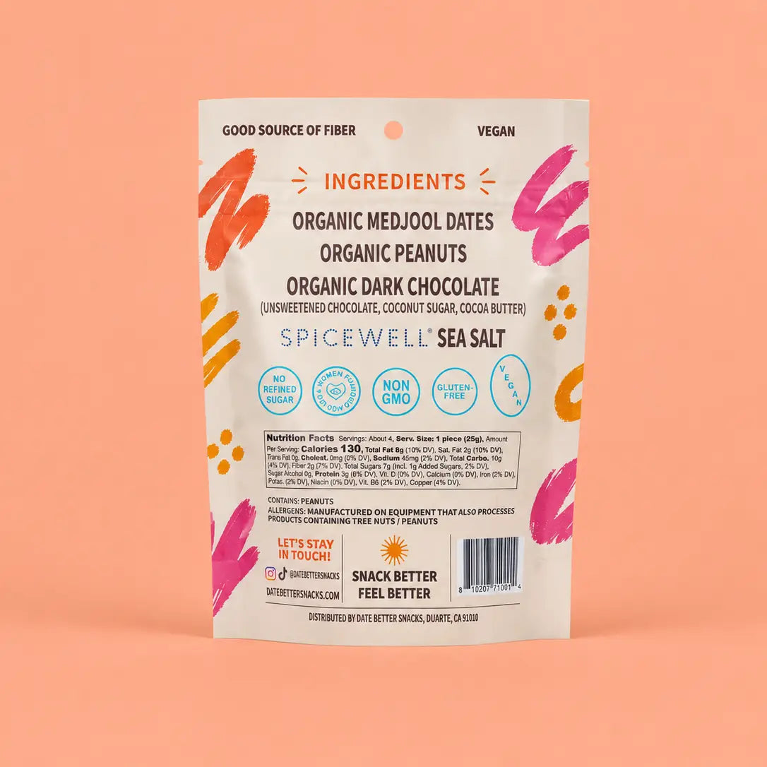 A single stand-up pouch of Spicewell Sea Salt Organic Medjool Dates Organic Peanuts Organic Dark Chocolate snack mix, shown against a solid peach-pink background. The packaging is cream-colored with orange, pink, and yellow graphic accents.