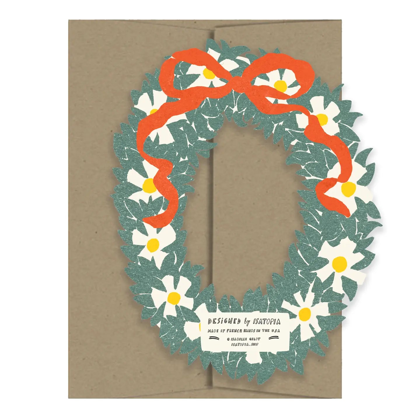 A square kraft paper envelope with a layered pop-up floral wreath design on the front. The wreath features white daisies with yellow centers, textured teal-green leaves, and a bright orange ribbon bow, with a small white label at the bottom reading 'Designed by STATFORA'.