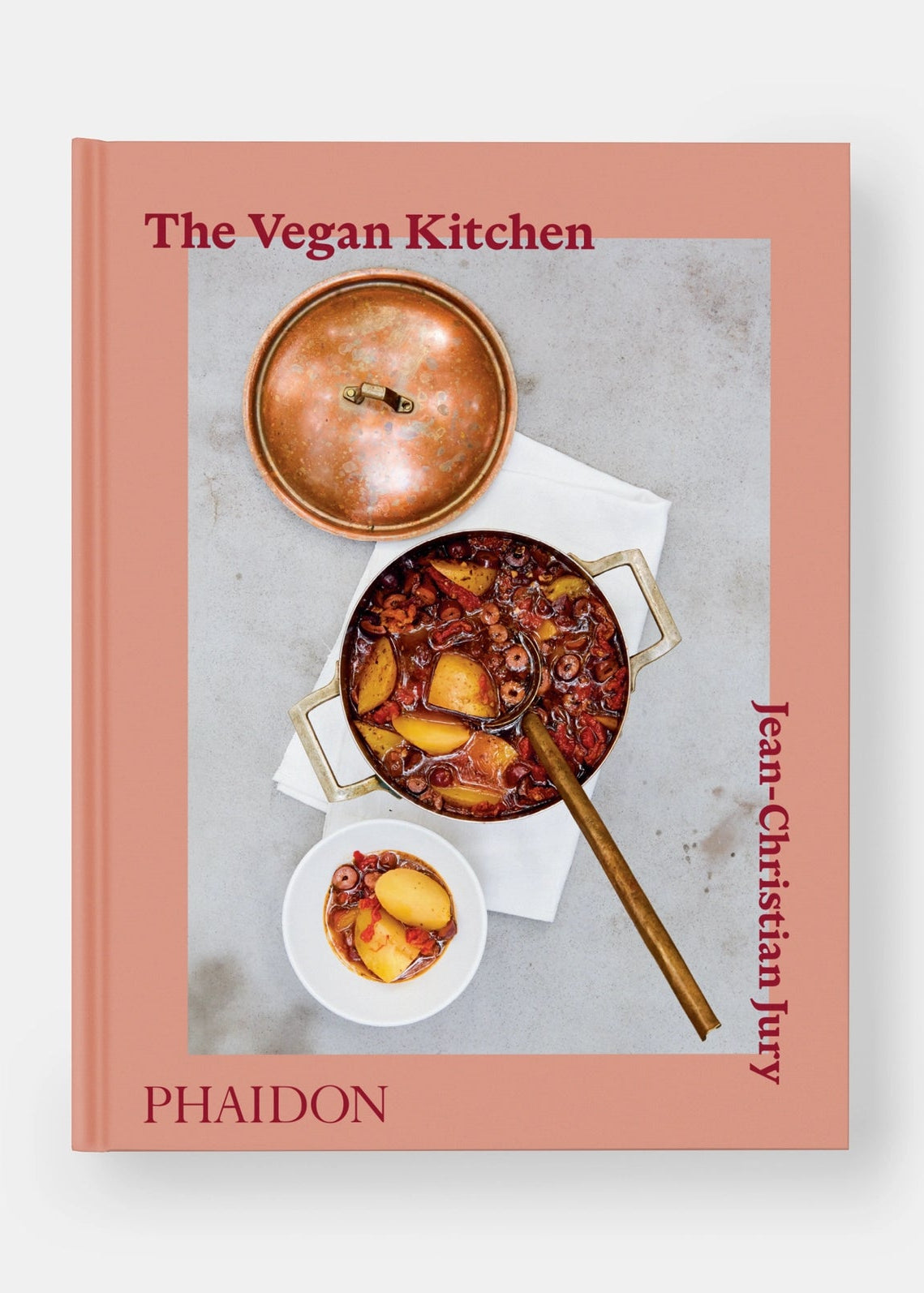 Book cover of 'The Vegan Kitchen' by PHAIDON with a vegan dish on a pink background