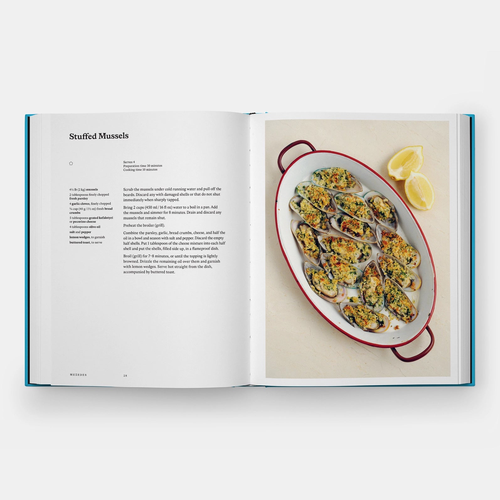 Open cookbook showing a recipe for stuffed mussels with an image of the dish on a white background.