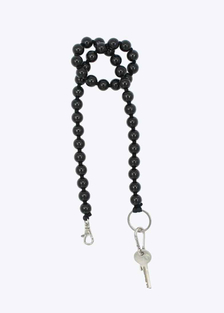 Black beaded lanyard with key holder on a white background