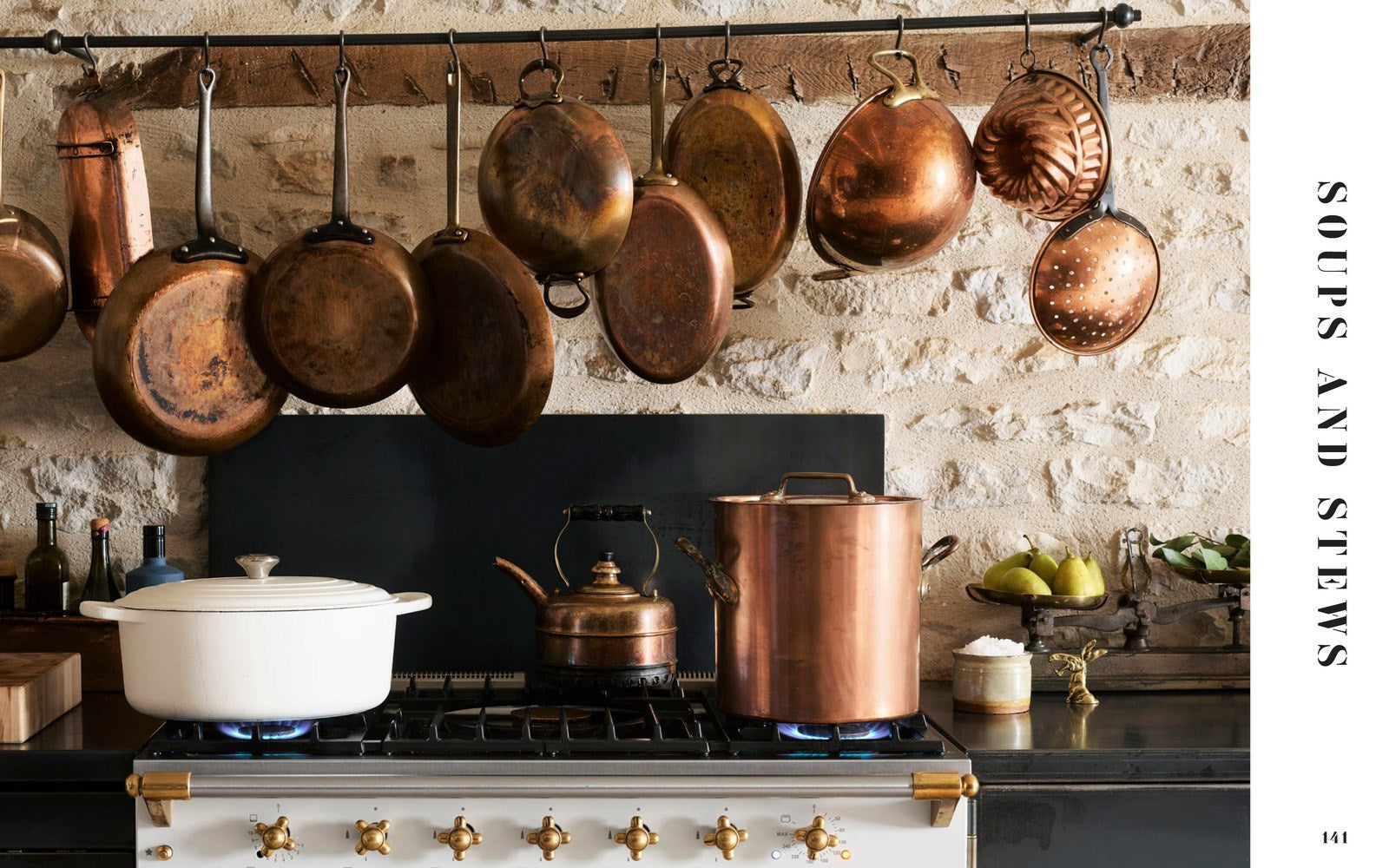copper pot display in a french kitchen