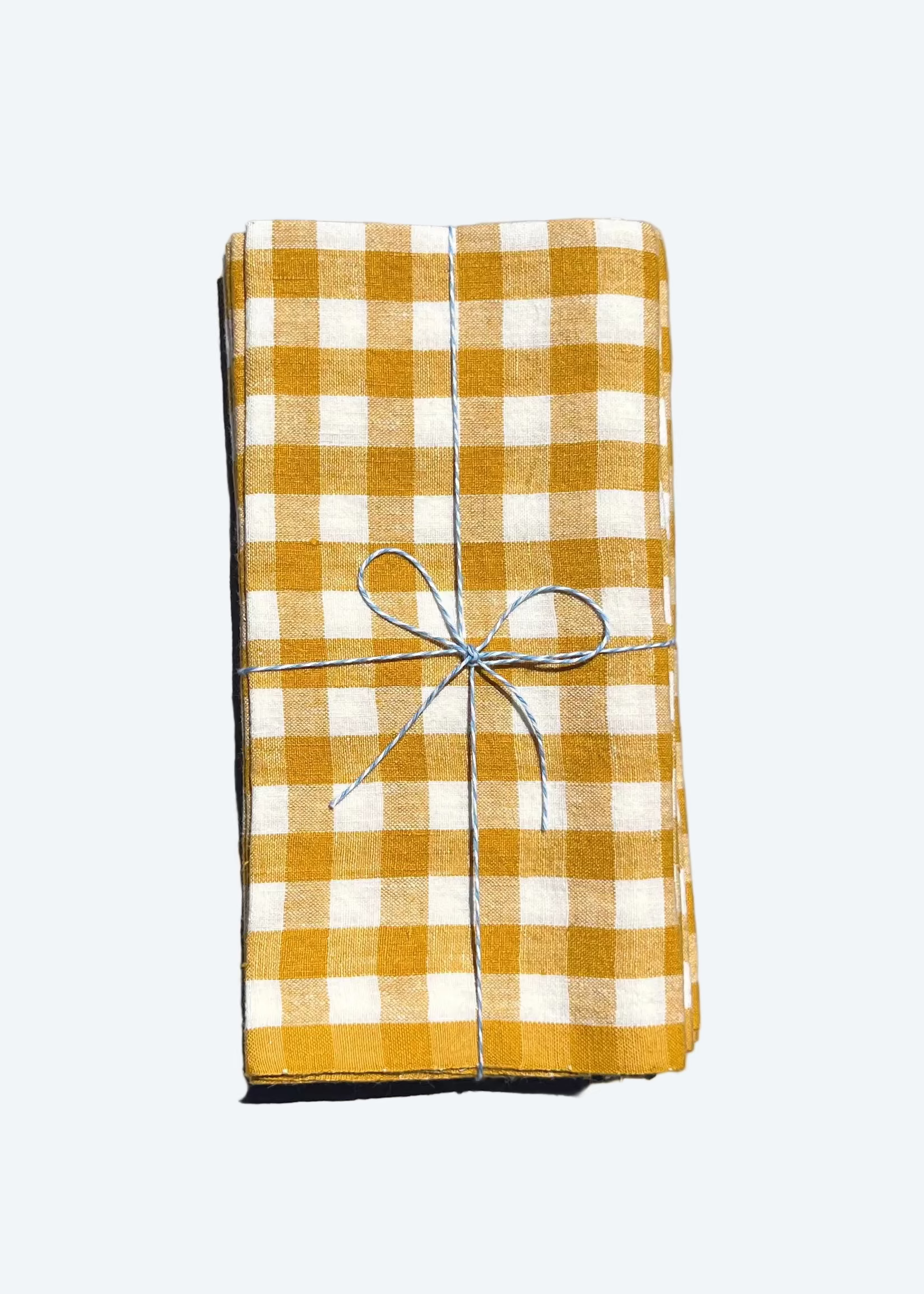 linen checkered napkins in turmeric with bow