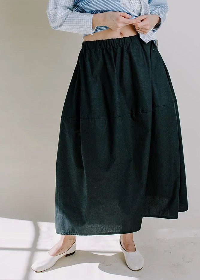 model wearing black vase shaped skirt