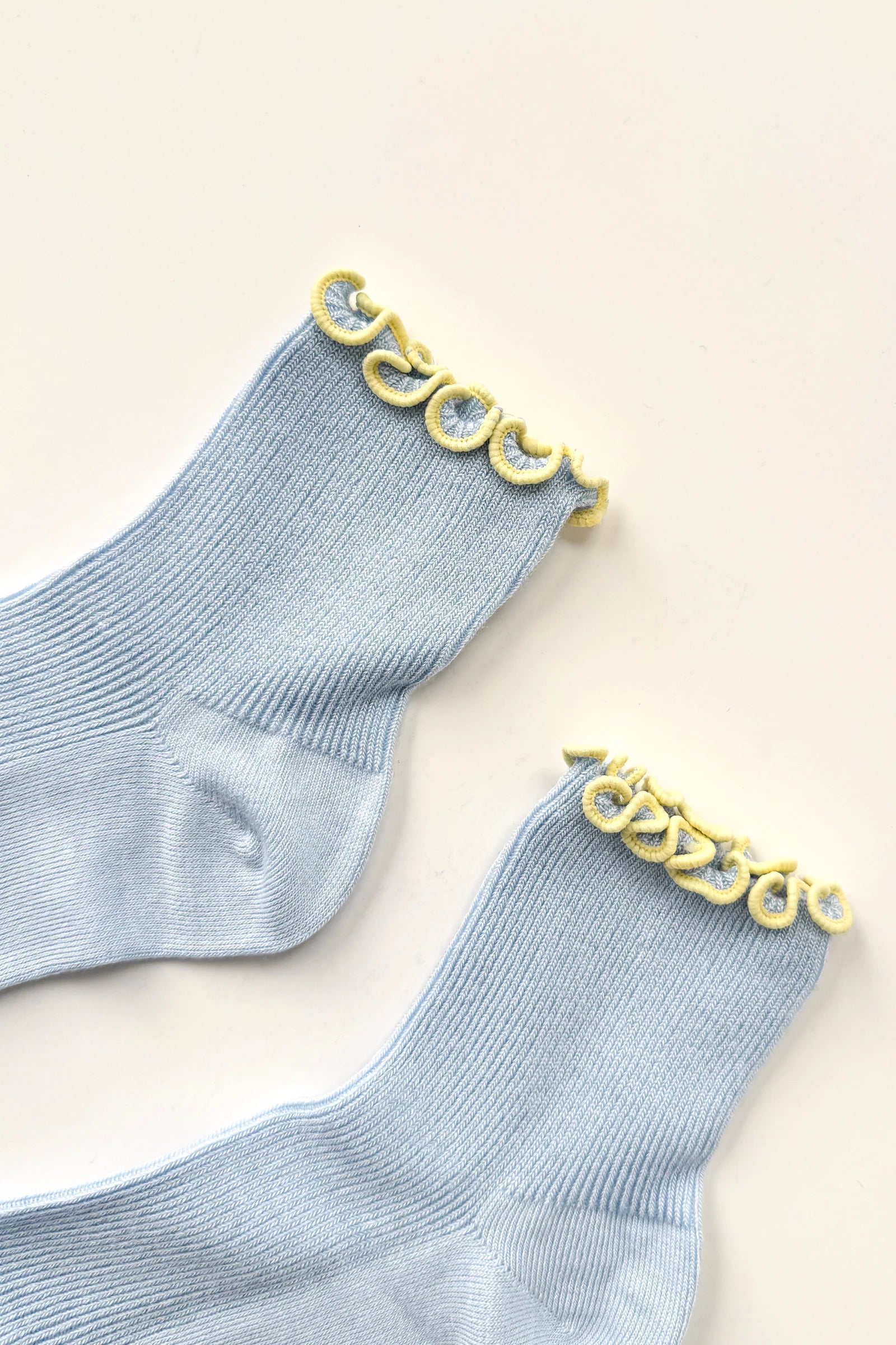 baby blue socks with butter ruffles