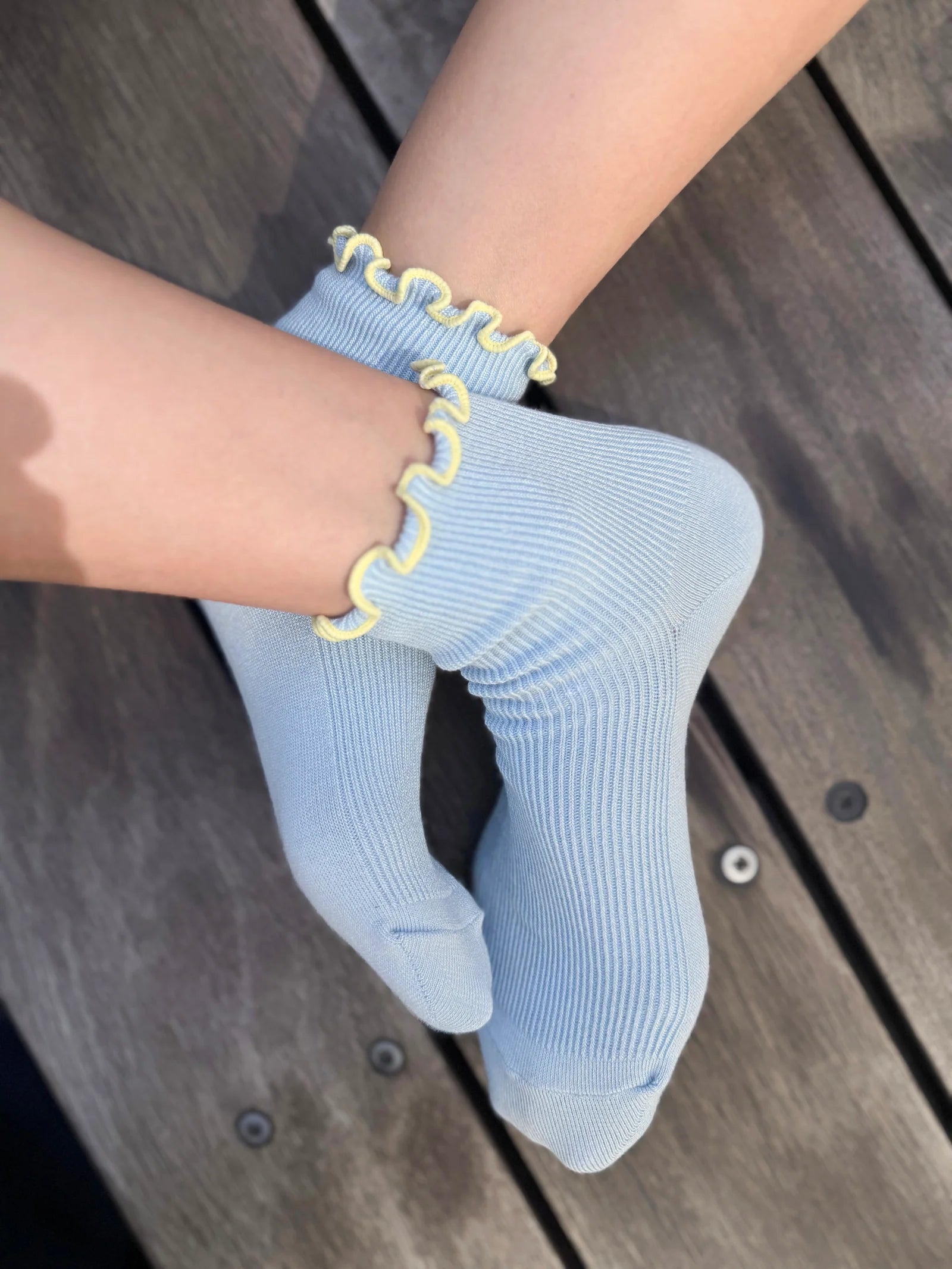 baby blue socks with butter ruffles