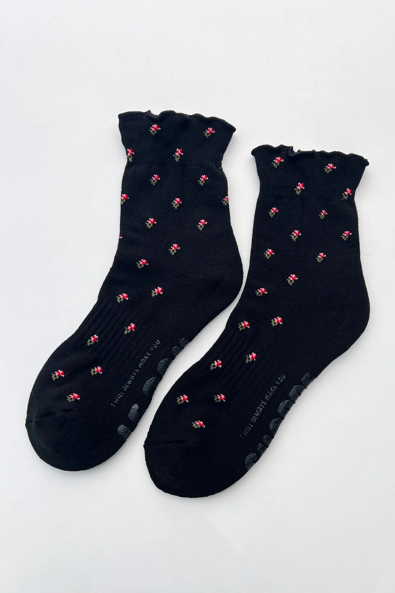 Black socks with pink patterns on a white background