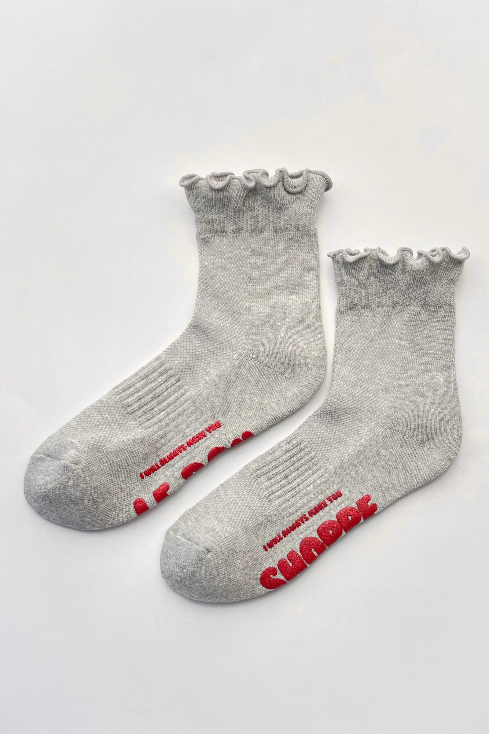 A pair of light heather gray ankle socks with ruffled cuffs