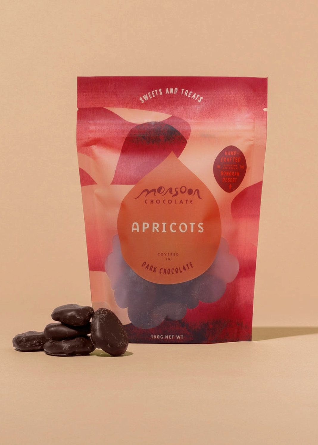 Packaging of Monsoon's Chocolate Apricots on a beige background