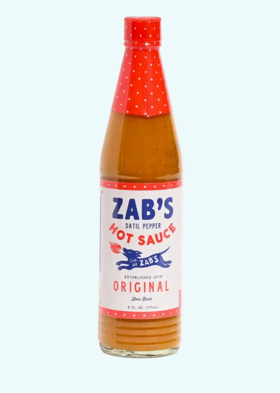 Bottle of Zab's Hot Sauce with a red cap on a white background