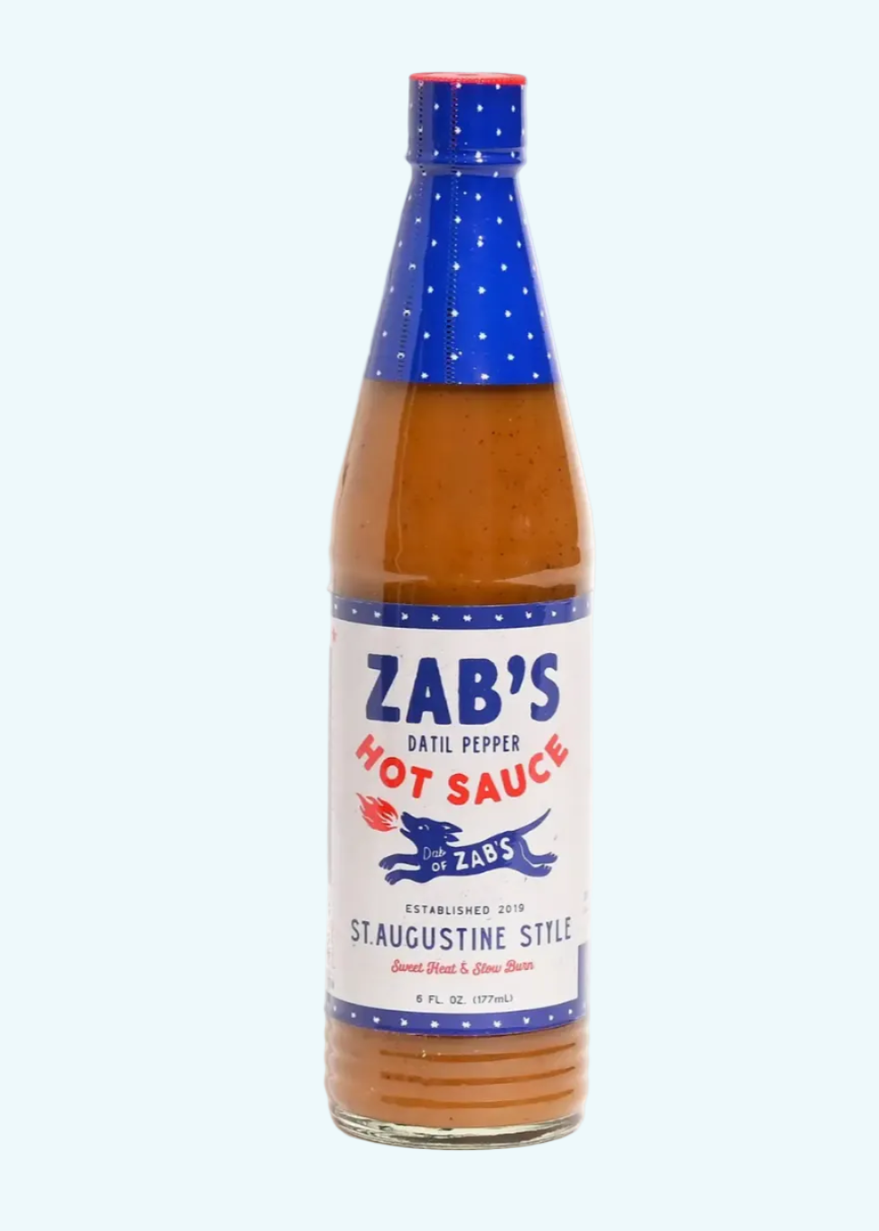 Bottle of Zab's hot sauce with blue cap and label on a white background