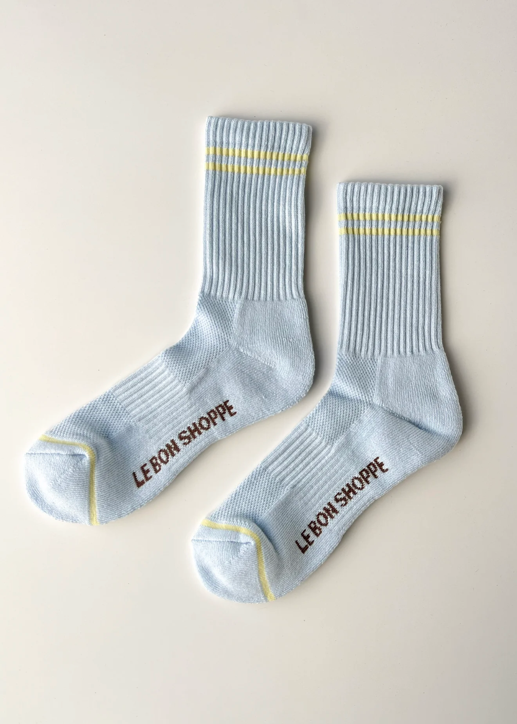 light blue socks with yellow stripes