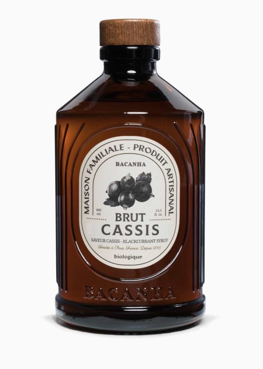 brown glass bottle with white label and black text and drawing of berries