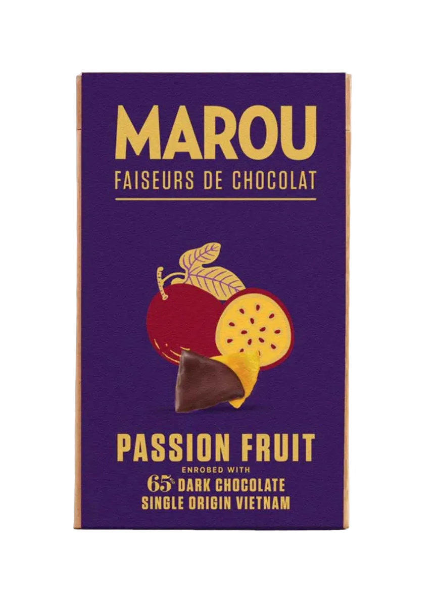 A Marou chocolate bar package labeled 'Passion Fruit' in gold lettering on a deep purple background, with an illustration of a red passion fruit and a piece of dark chocolate. The package is photographed against a light beige background.