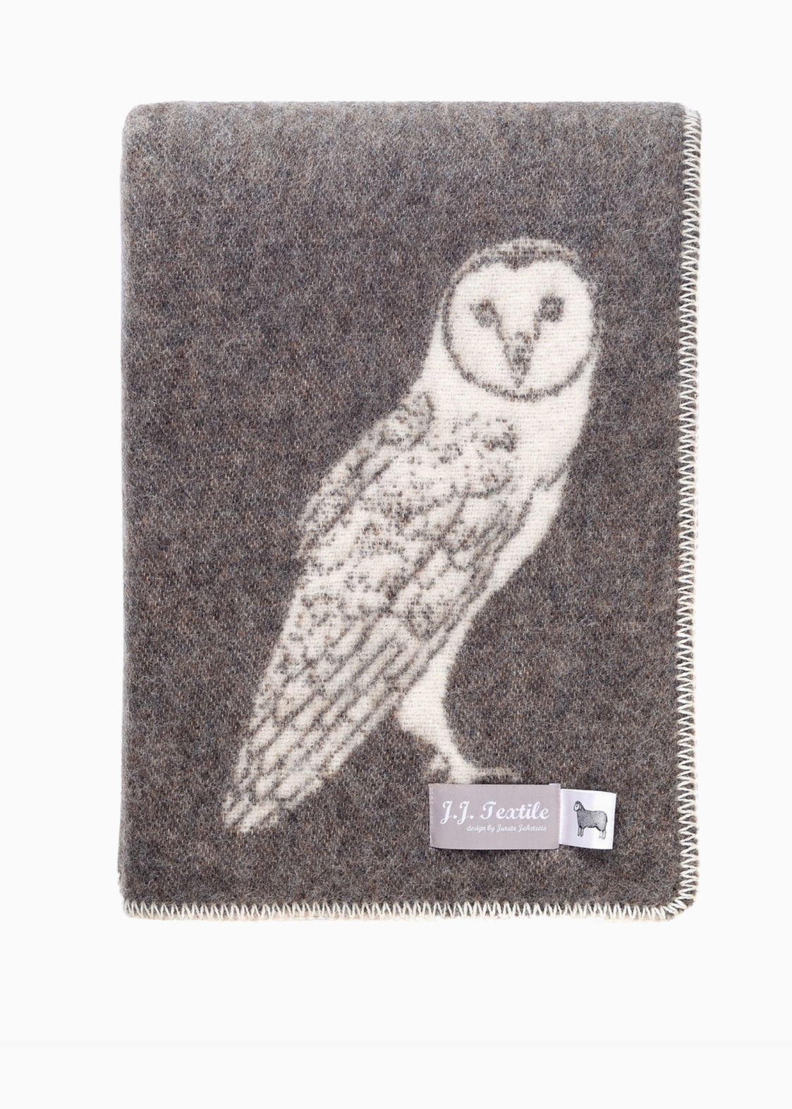 brown blanket with white owl