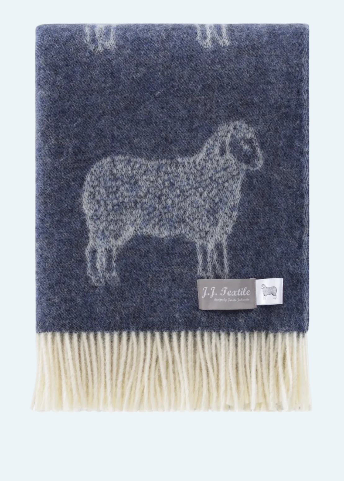 dark blue blanket with fringe and sheep design