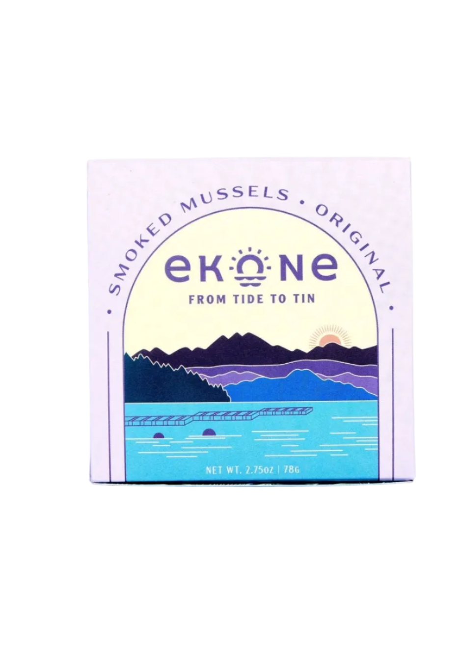 A square product box for Smoked Mussels, Original, featuring a stylized illustration of a lake, mountains, and an orange sun on a light lavender background.