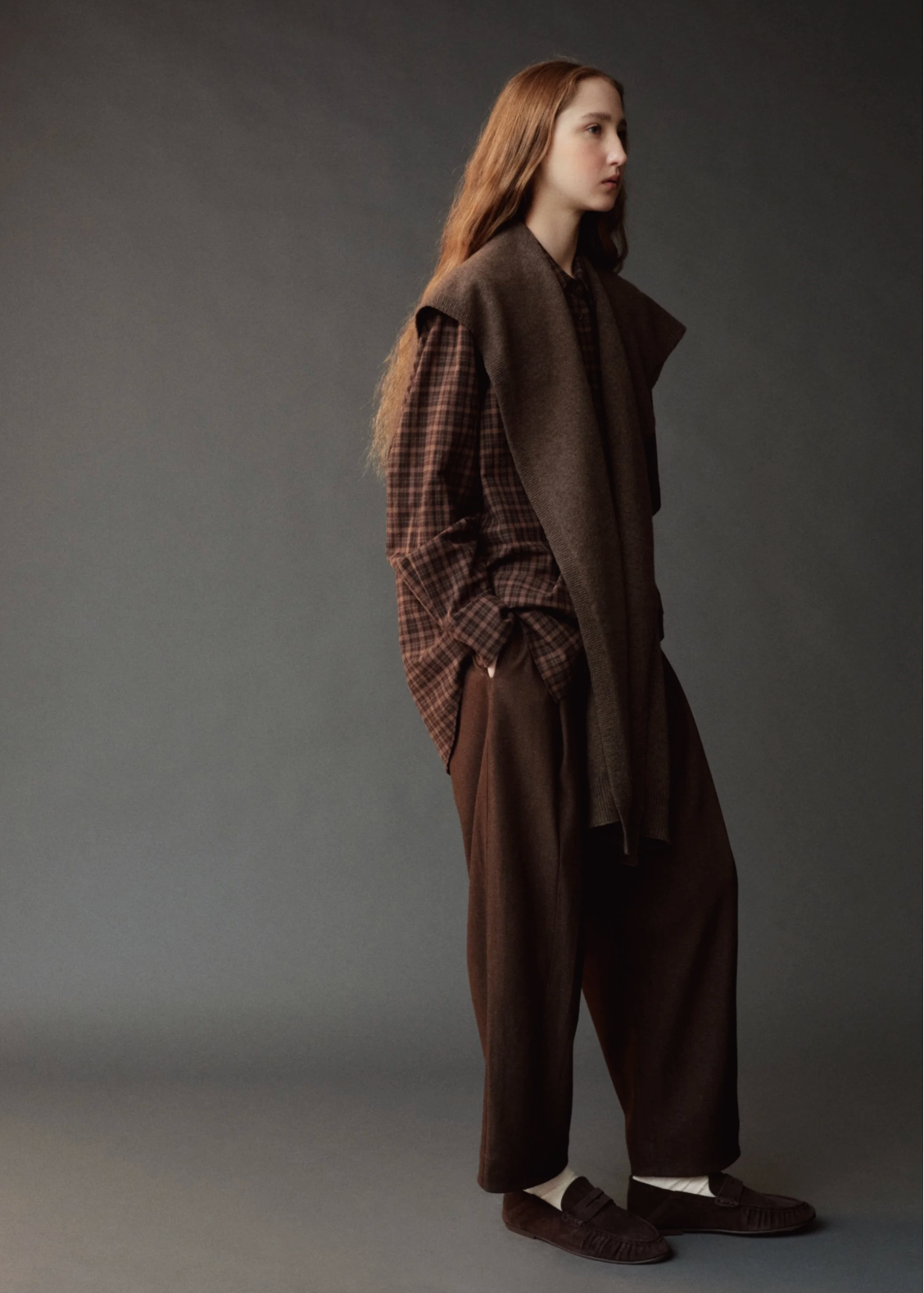 Brown shawl on model wearing a brown outfit