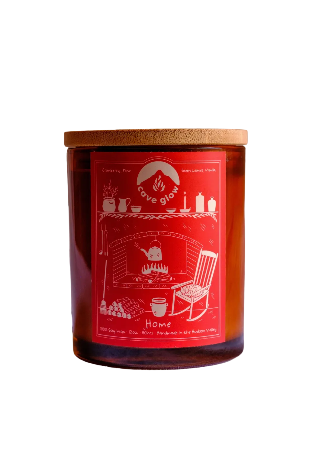 amber glass candle with wooden lid and red label with drawing of "home," a fire place with tea pot boiling, a mantle with candle and decorations, a rocking chair, broom and other little details