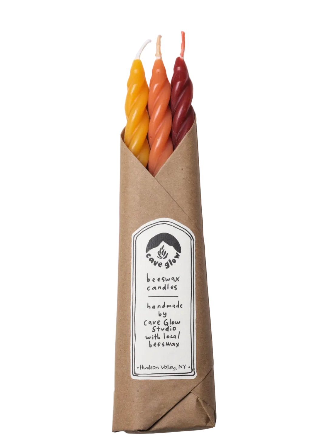 A package of three handcrafted wax candles in a brown kraft paper sleeve with a white label. The candles are twisted and come in three colors: yellow, orange, and red.