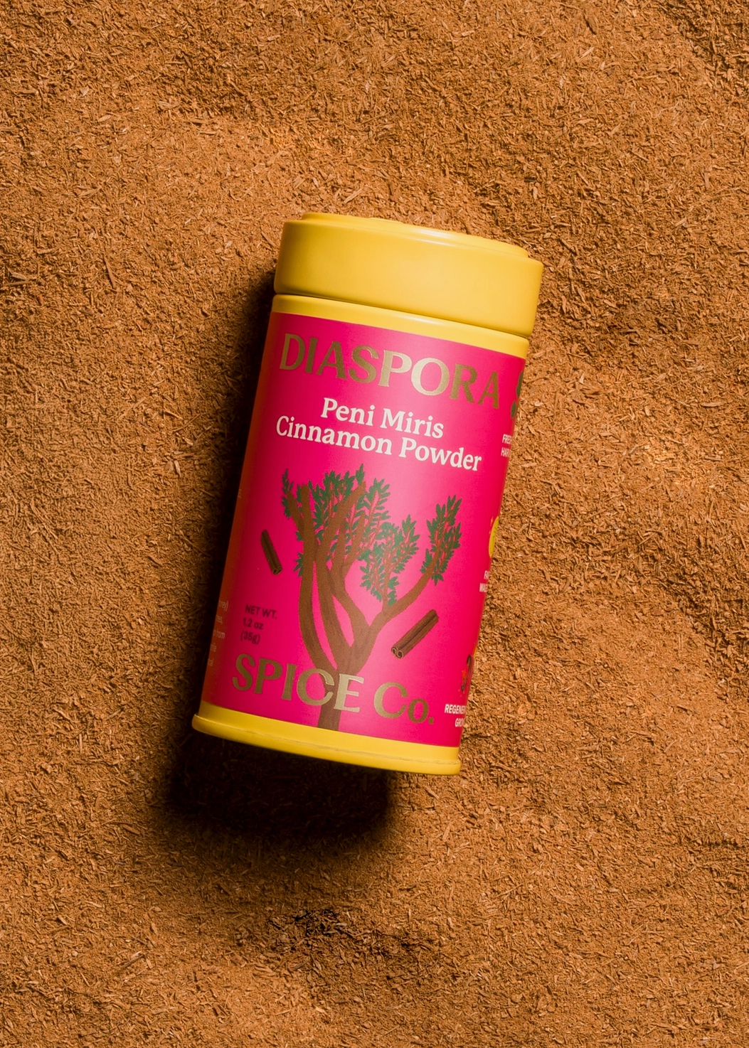 background of cinnamon with tin packaging 