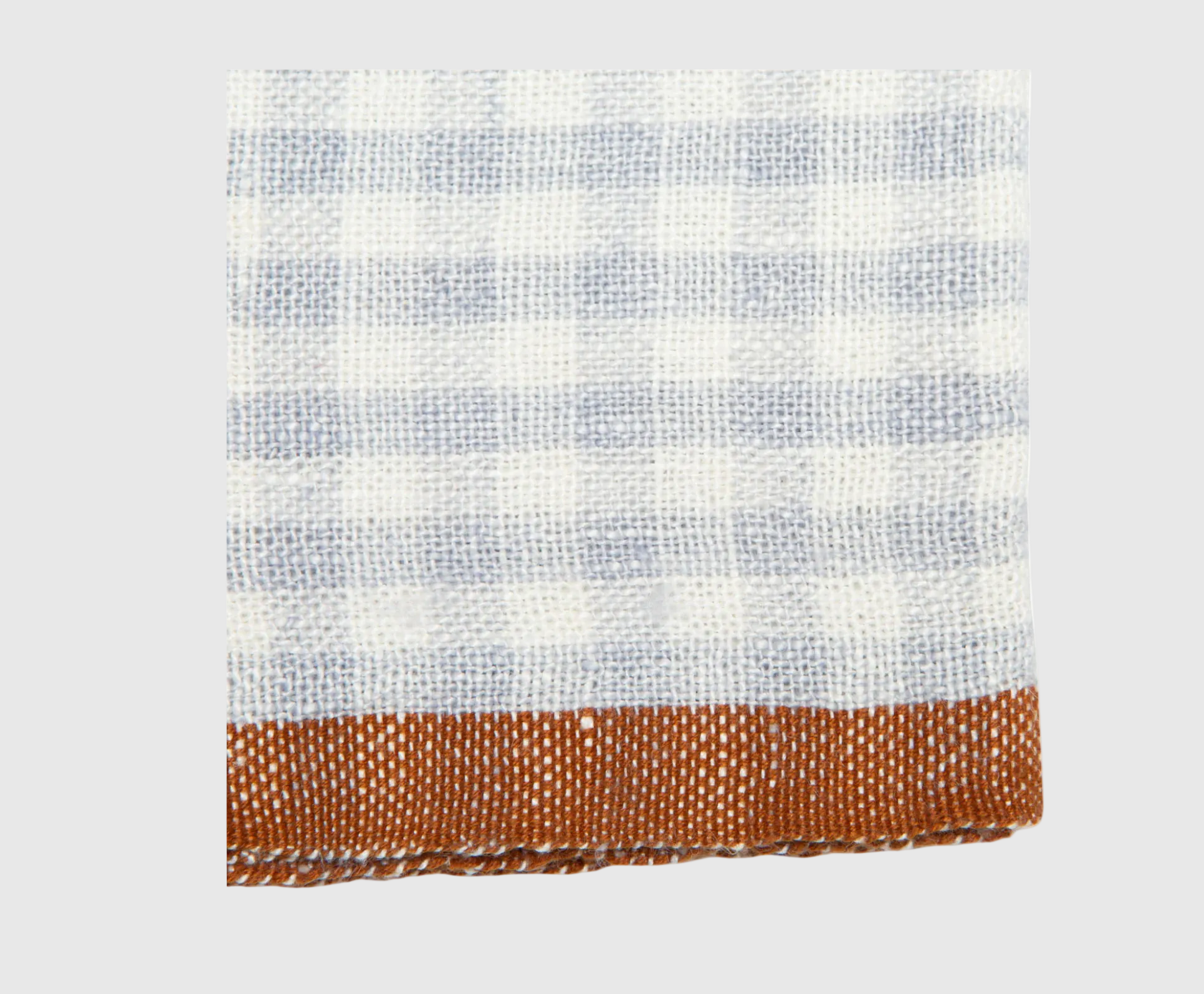 Checkered fabric with a brown border on a white background