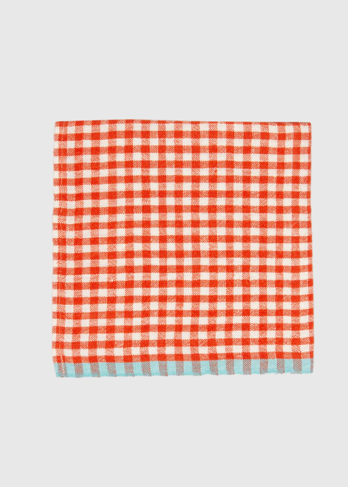 Red and white checkered towel on a white background