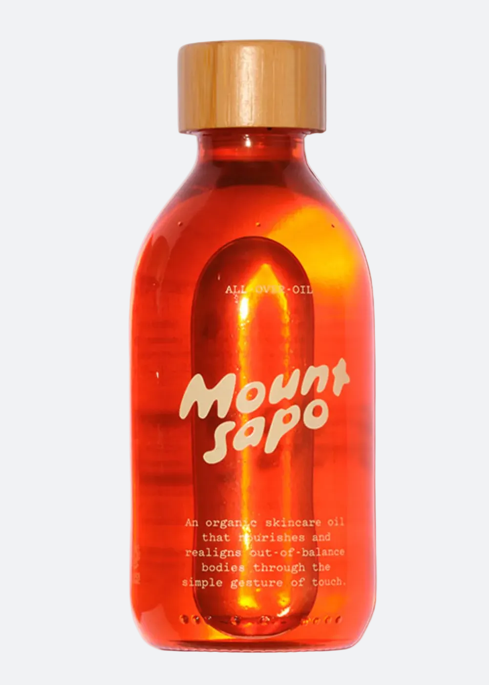 A bottle of Mount Sapo oil with wooden caps on a white background