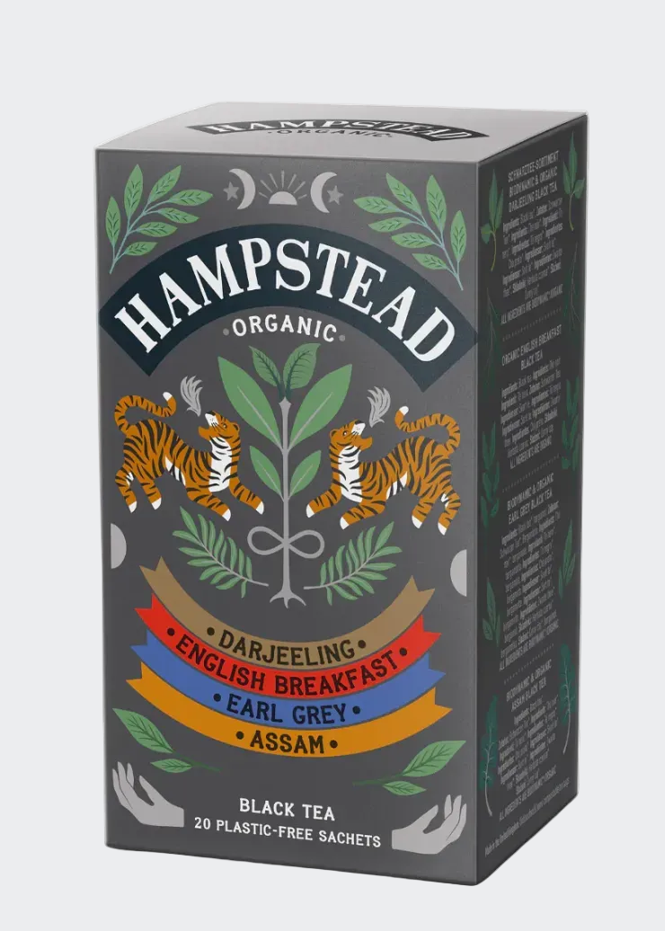 Hampstead Organic black tea packaging with tigers and tea types on a gray background
