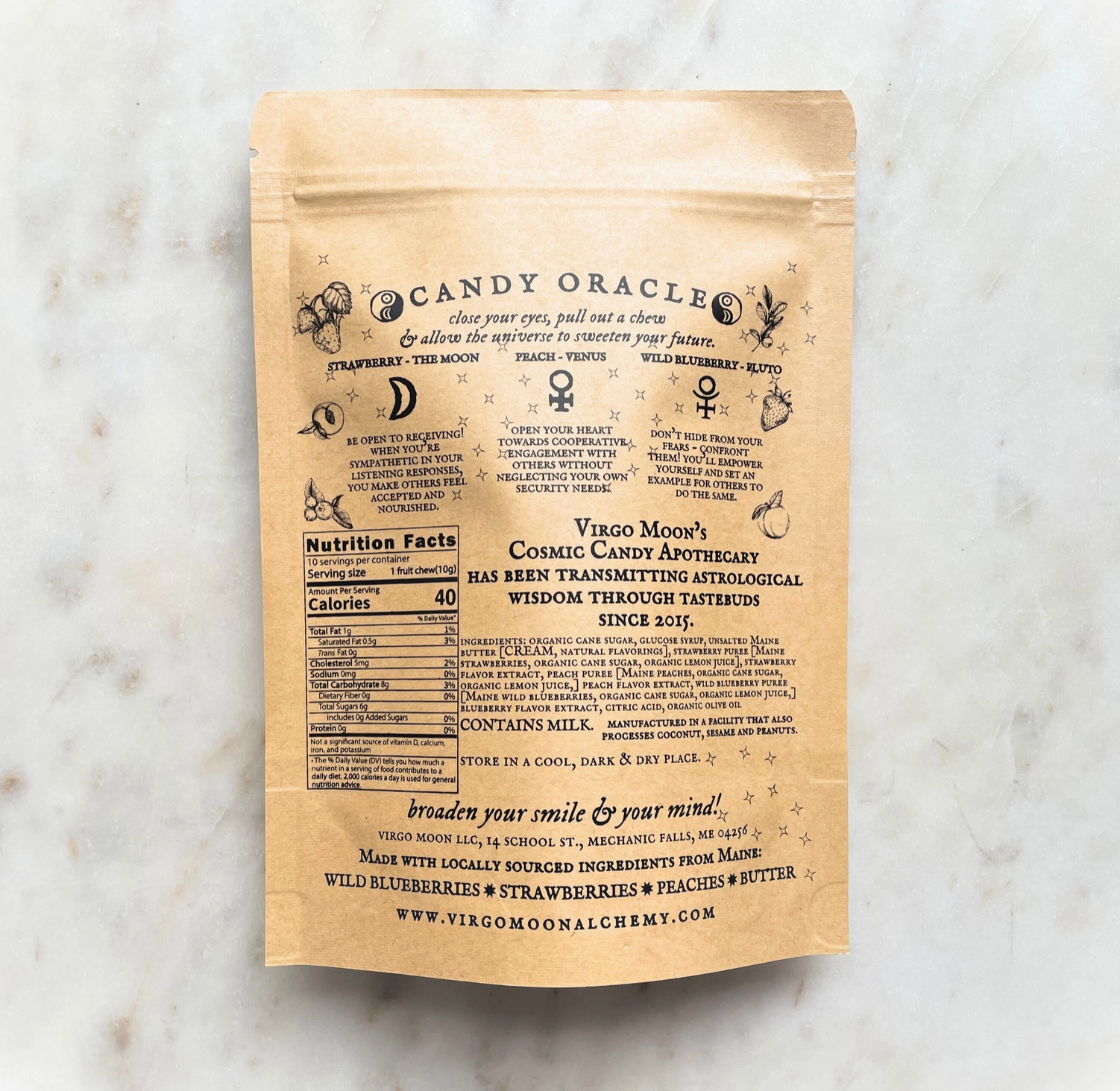 Kraft paper package with text and branding on a marble surface