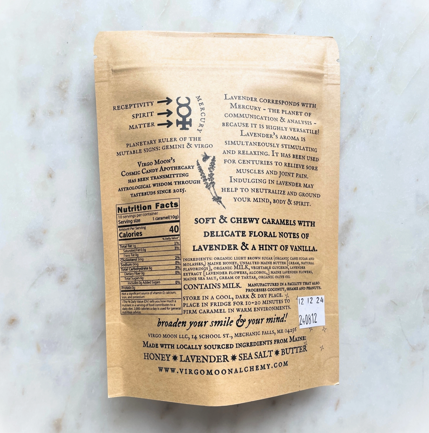 Brown paper package with black text on a marble surface
