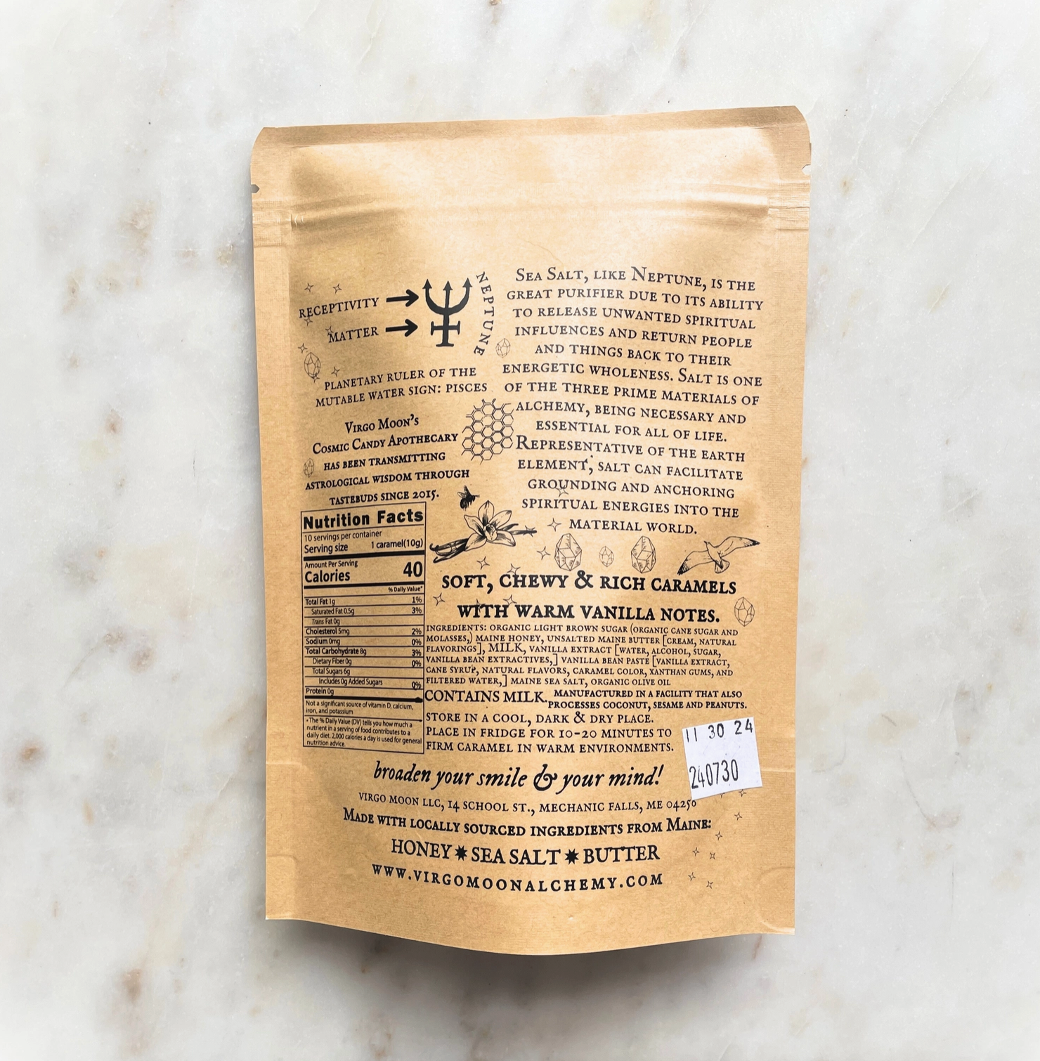 Kraft paper package with black text on a marble surface