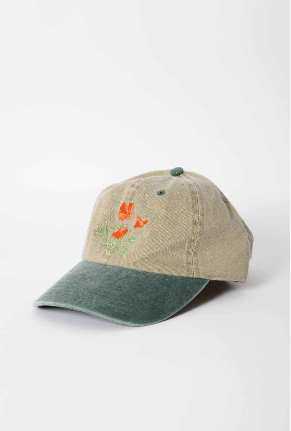 Baseball cap with floral design on a white background