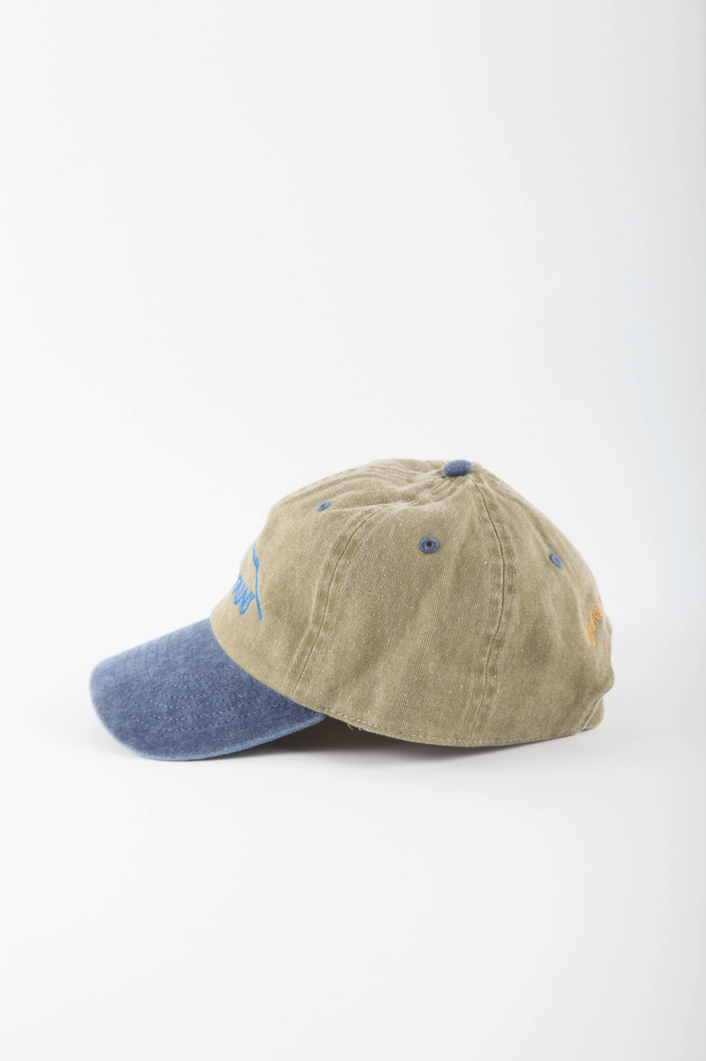 a beige and blue hat