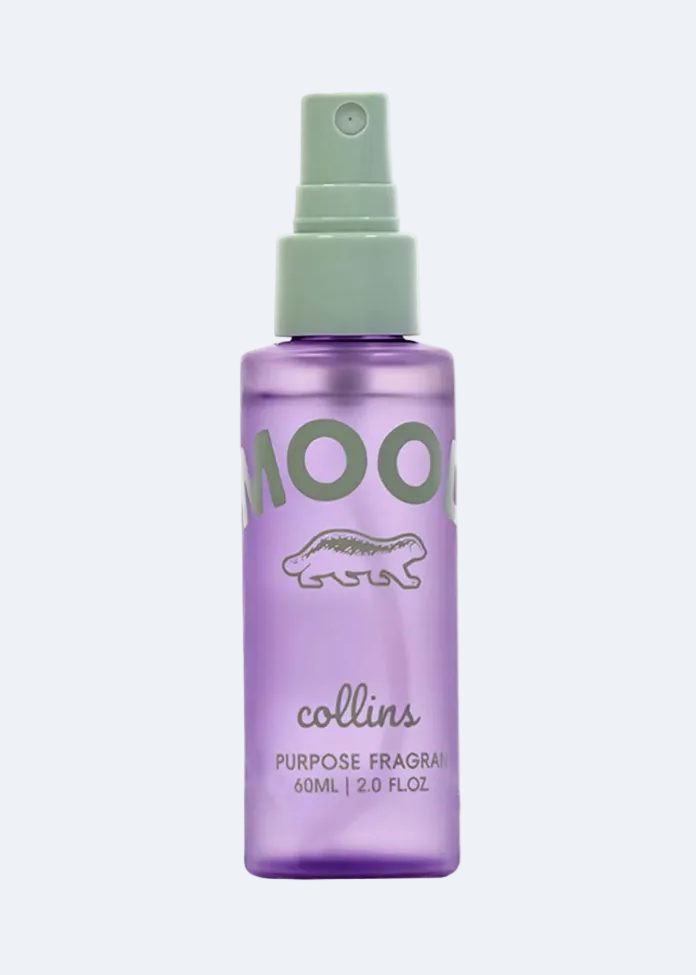 Purple spray bottle with green cap labeled 'MOO' on a white background