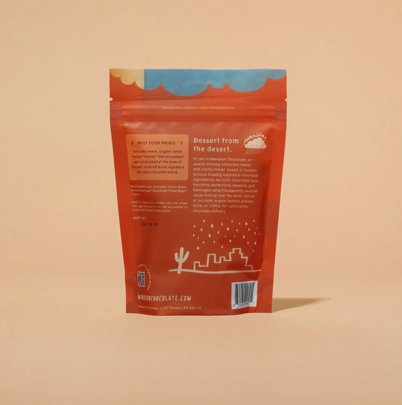 Back view of a red packaging with desert-themed graphics on a beige background