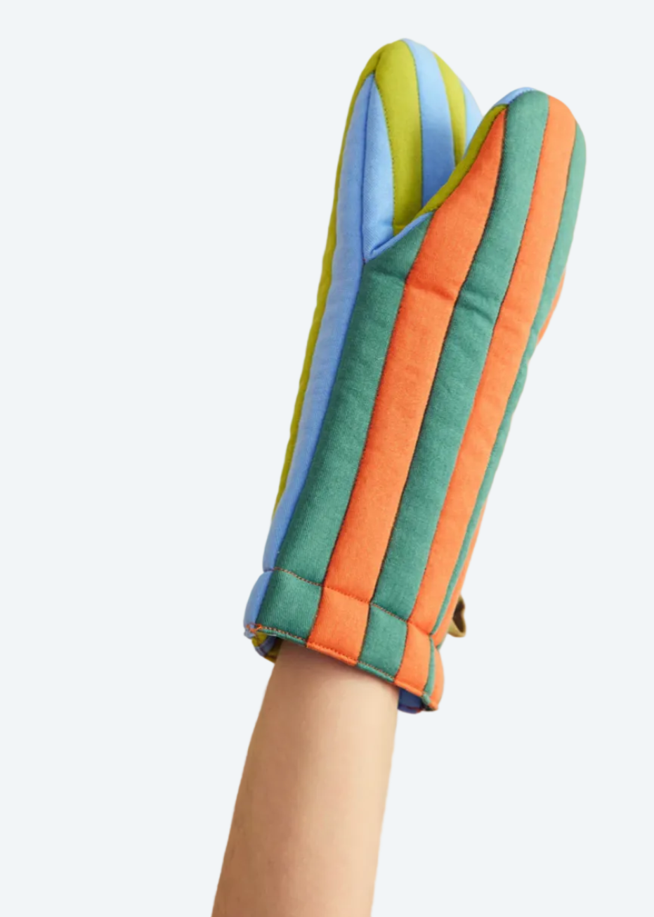 arm wearing striped pot holder