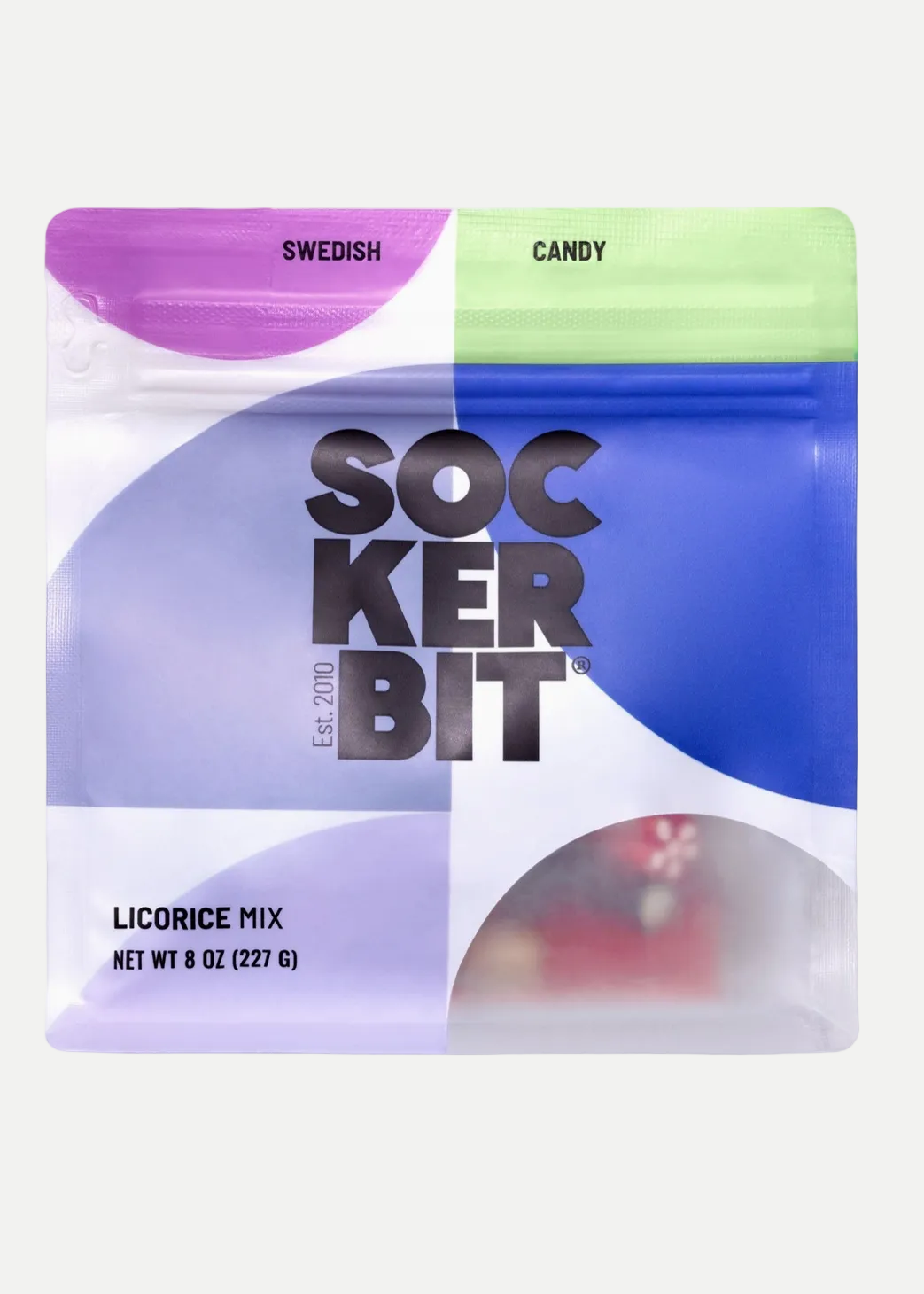 A square resealable pouch of Sockerbit Licorice Mix candy, featuring a modern graphic design with purple, blue, and light green sections on a white background.
