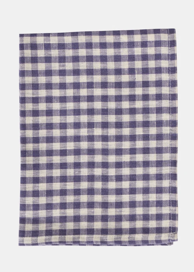 A square woven featuring a plum and white gingham check pattern, laid flat against a light gray background.