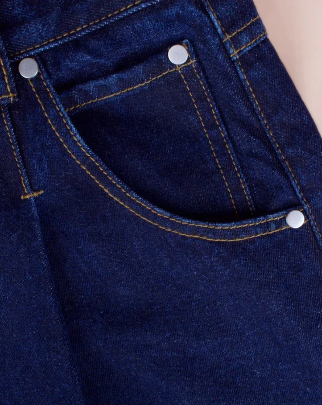 close up of pocket and pleats of the jeans