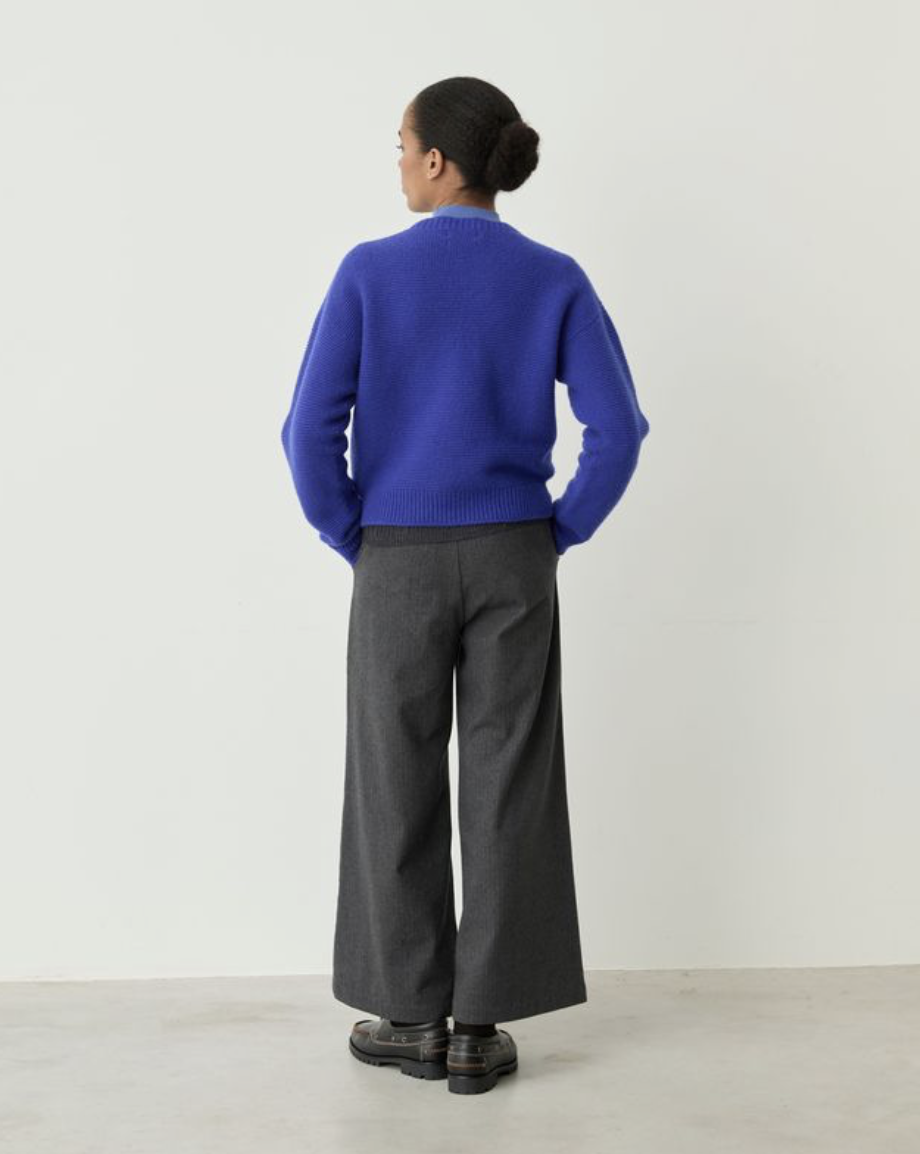 button up blue cardigan on model