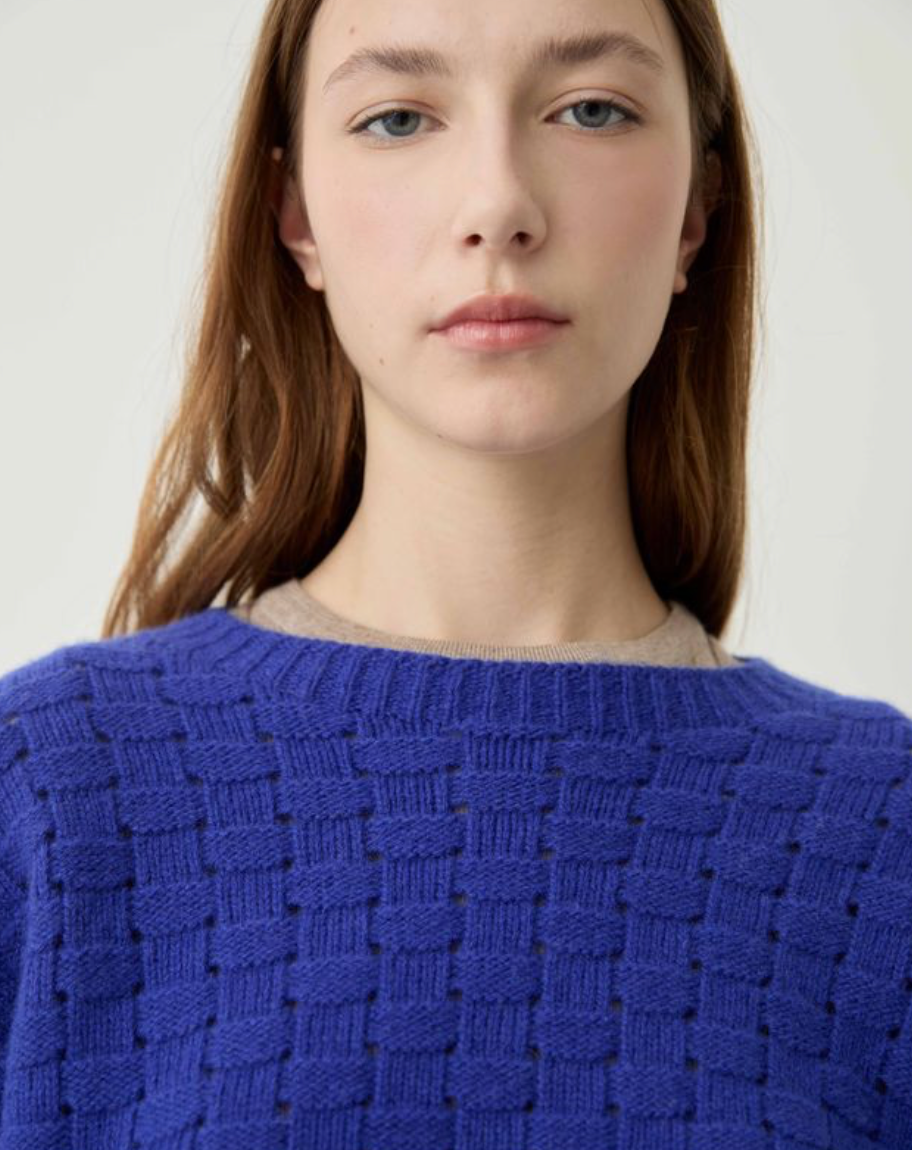 textured blue sweater on model