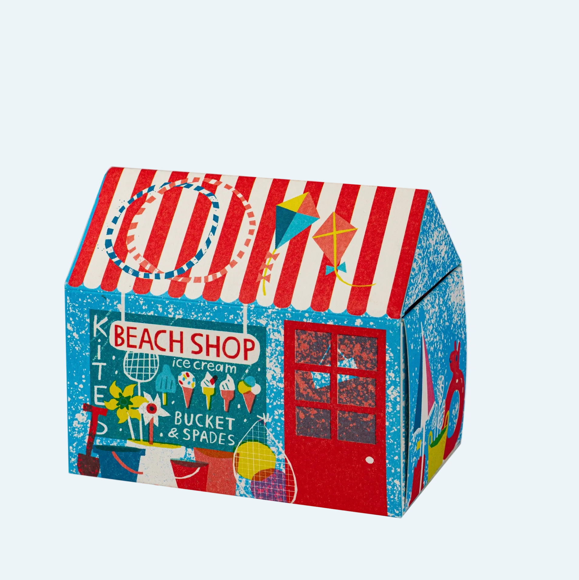 illlustrated seaside match box with stripes ice creams and spades in the window a red door and more beachy drawings