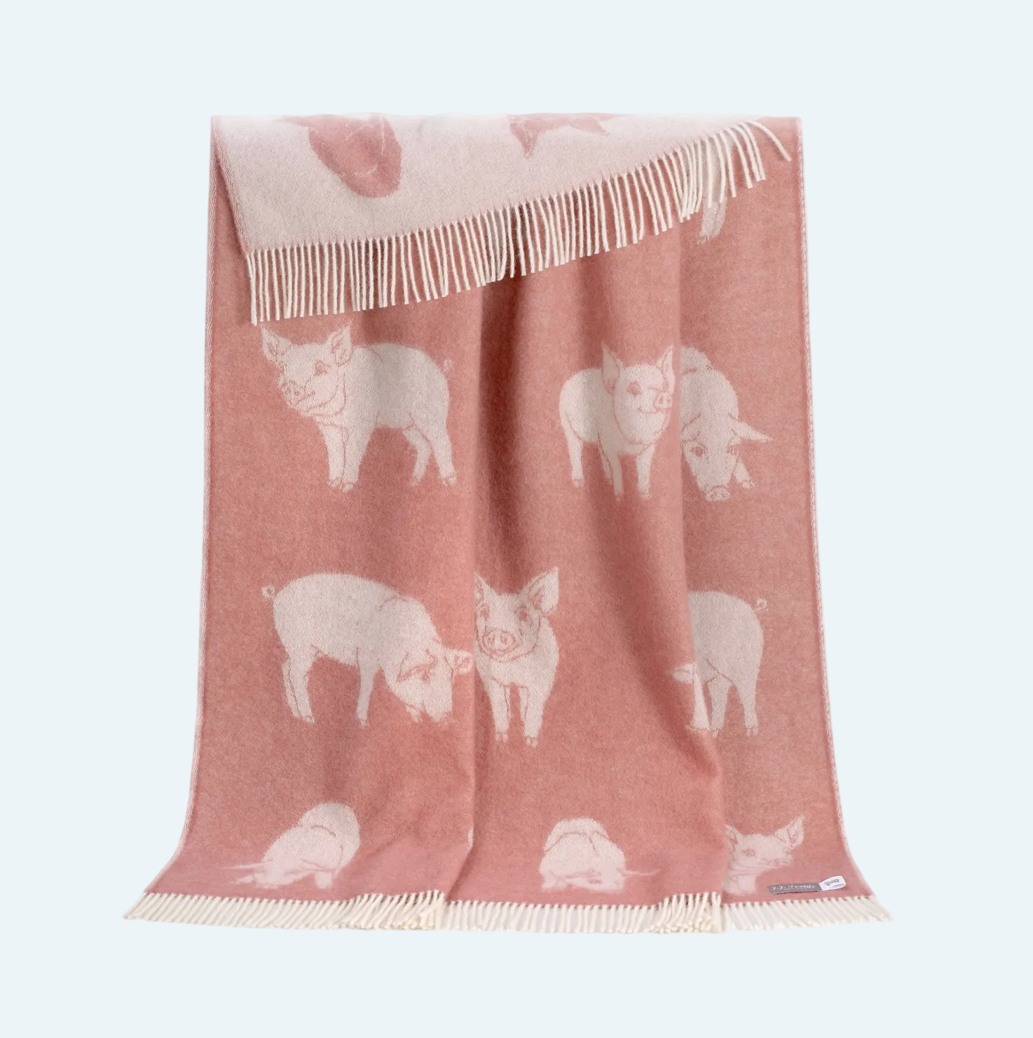 pink blanket with piglet design and white fringe