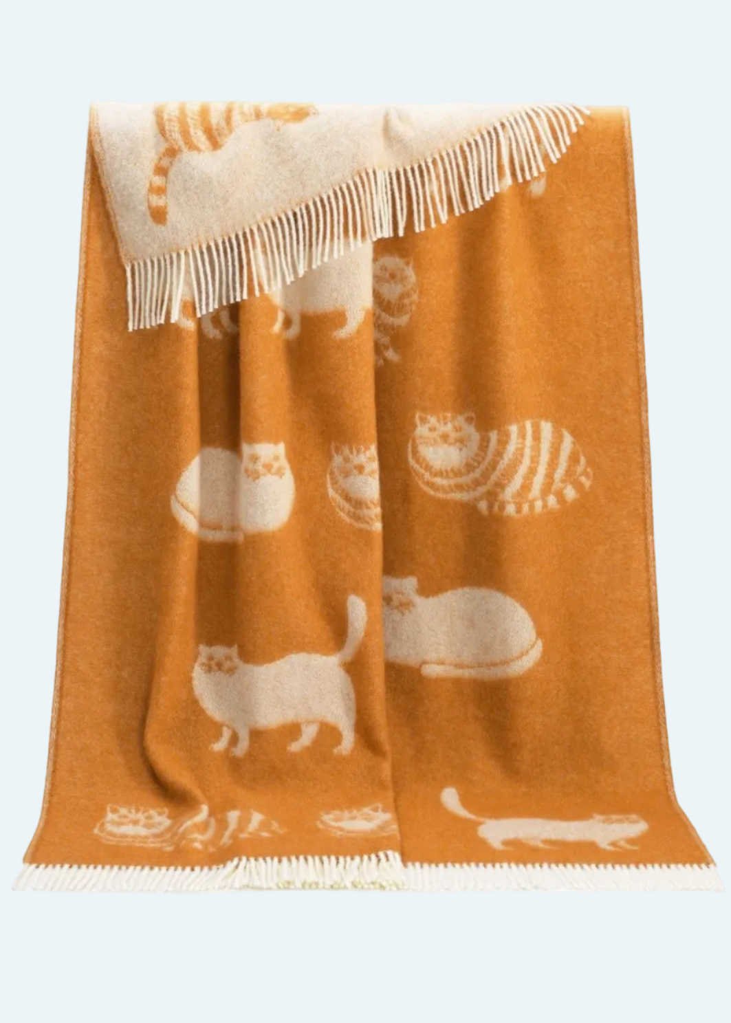 orange blanket with cats and fringe