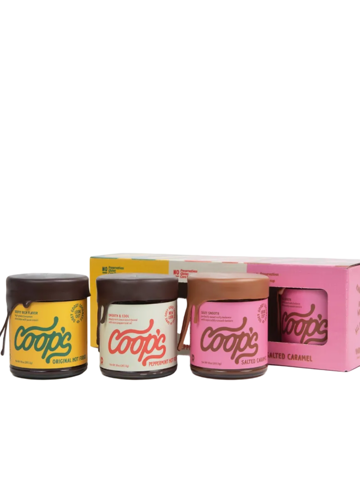 Three jars of Cooops chocolate spread with different colored lids and labels are displayed in front of a pink and yellow box on a white background, captured within a web browser screenshot.